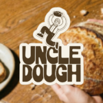 Uncle Dough bakery logo sticker featuring illustrated baker character on rustic bread background