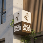 Uncle Dough bakery exterior signage with illuminated cube sign and Nordic-inspired branding